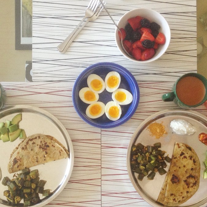 Eggs alongside an Indian breakfast of okra and paratha (whole-wheat flatbread). 